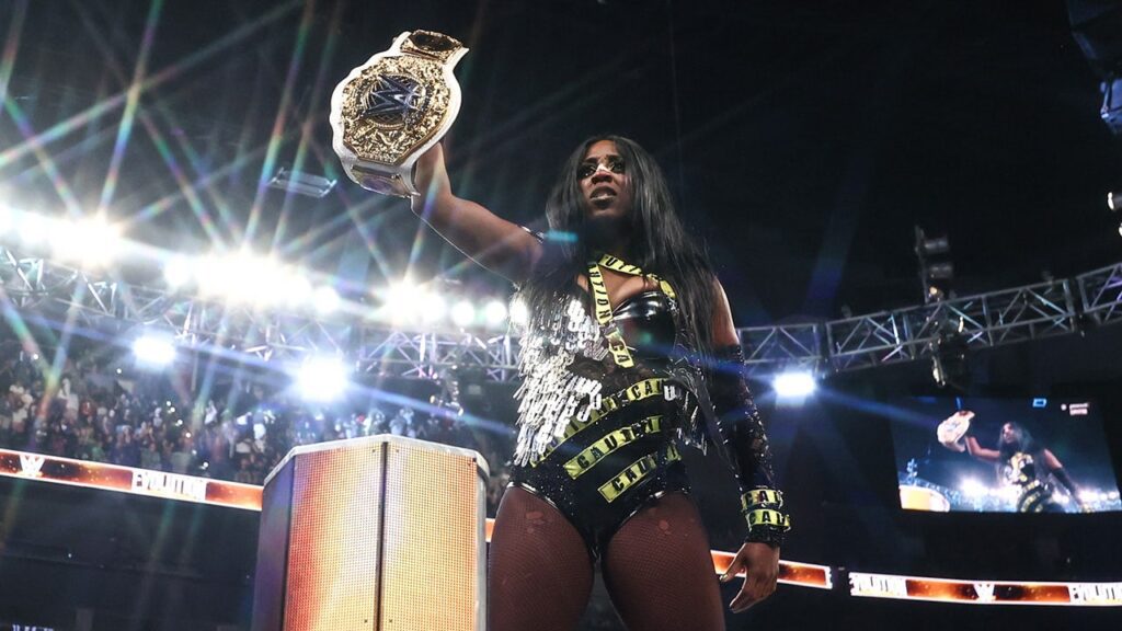 Naomi claims championship glory from iyo sky and rhea ripley